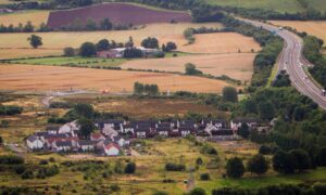 View od Oudanarde site, with some houses and the M90 motorway running alongside.