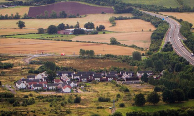 View od Oudanarde site, with some houses and the M90 motorway running alongside.