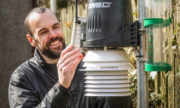 Graham Smith with his weather station in Fife. Image: Mhairi Edwards/DC Thomson