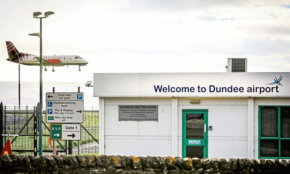 A plane landing at Dundee Airport