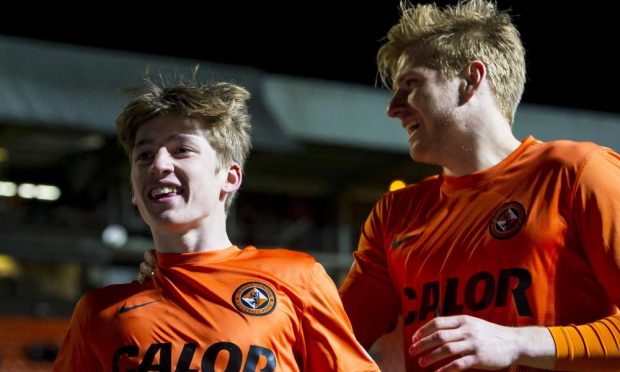 Mark Reynolds, left, applauds the United fans.