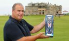 Giorgio Cozzolino at the Old Course showing off Old Tom Gin.