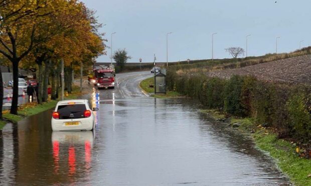 A car stuck in floodwater in East Wemyss, Fife