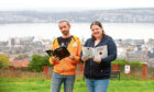 Louise Murphy and Stewart Heaton of Dark Dundee at Dundee Law with their books about the dark history of Dundee.