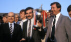 1985: Aberdeen icons Willie Miller and Sir Alex Ferguson with the Premier League trophy after presentation by league president David Letham (left).