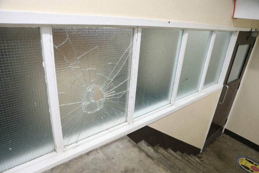 A broken window at Ancrum Court in Dundee