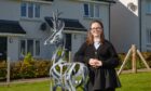 Hill of Beath Primary School pupil, Olivia Maxwell, 10, with the finished sculpture which she designed.