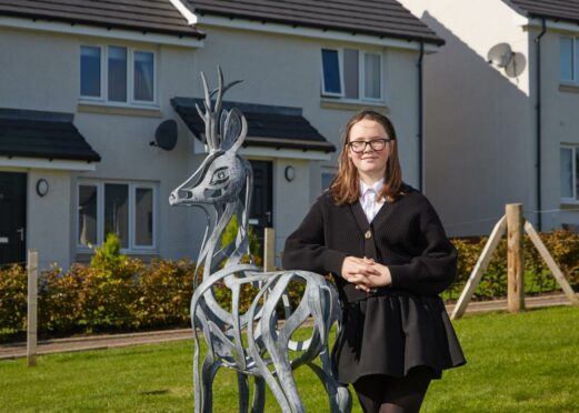 Hill of Beath Primary School pupil, Olivia Maxwell, 10, with the finished sculpture which she designed.