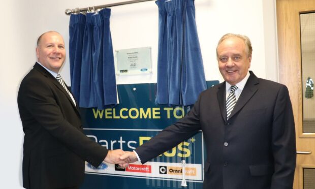 TrustFord chairman and chief executive Stuart Foulds officially opening PartsPlus Dundee alongside Kevin Magee, PartsPlus regional general manager.
