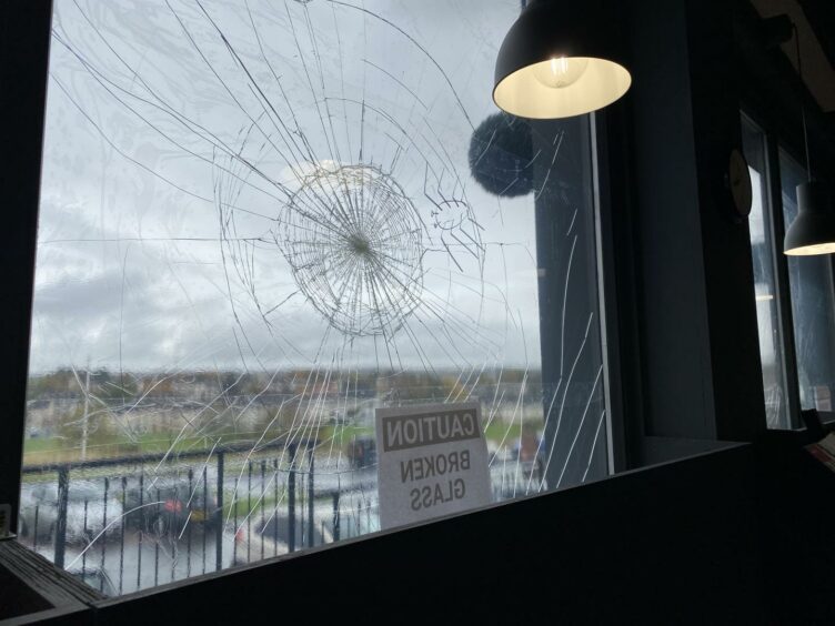 A window with a large crack in it
