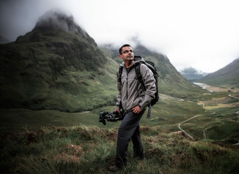 Photographer Shahbaz Majeed on a Scottish hillside