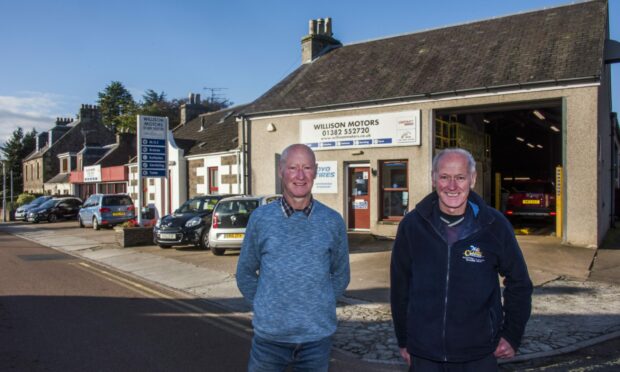Tom and his brother Billy Willison outside the Willison Motors garage.