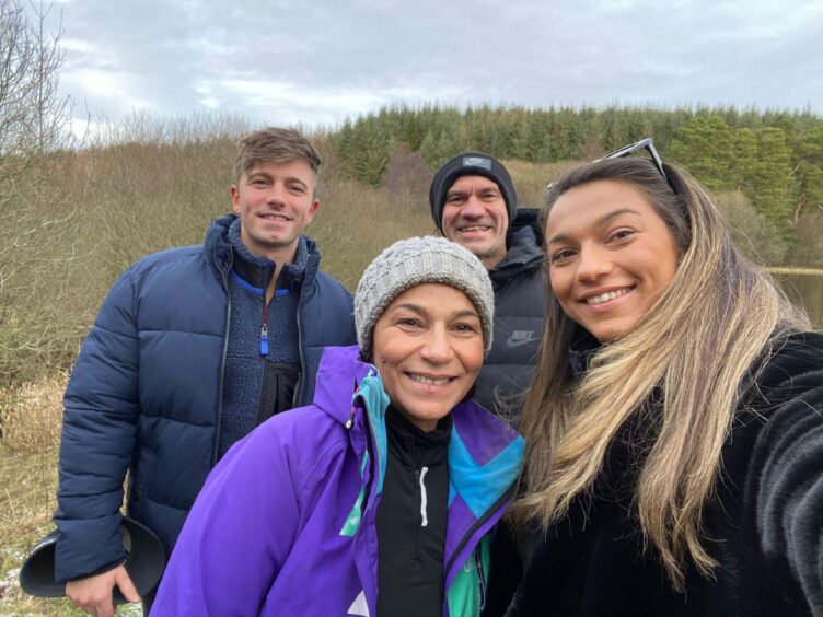 Paula Tabourel with Herve, Max and Roxanne.