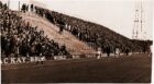 Dundee United and Celtic fans are separated on the terraces by police officers with dogs in 1975.