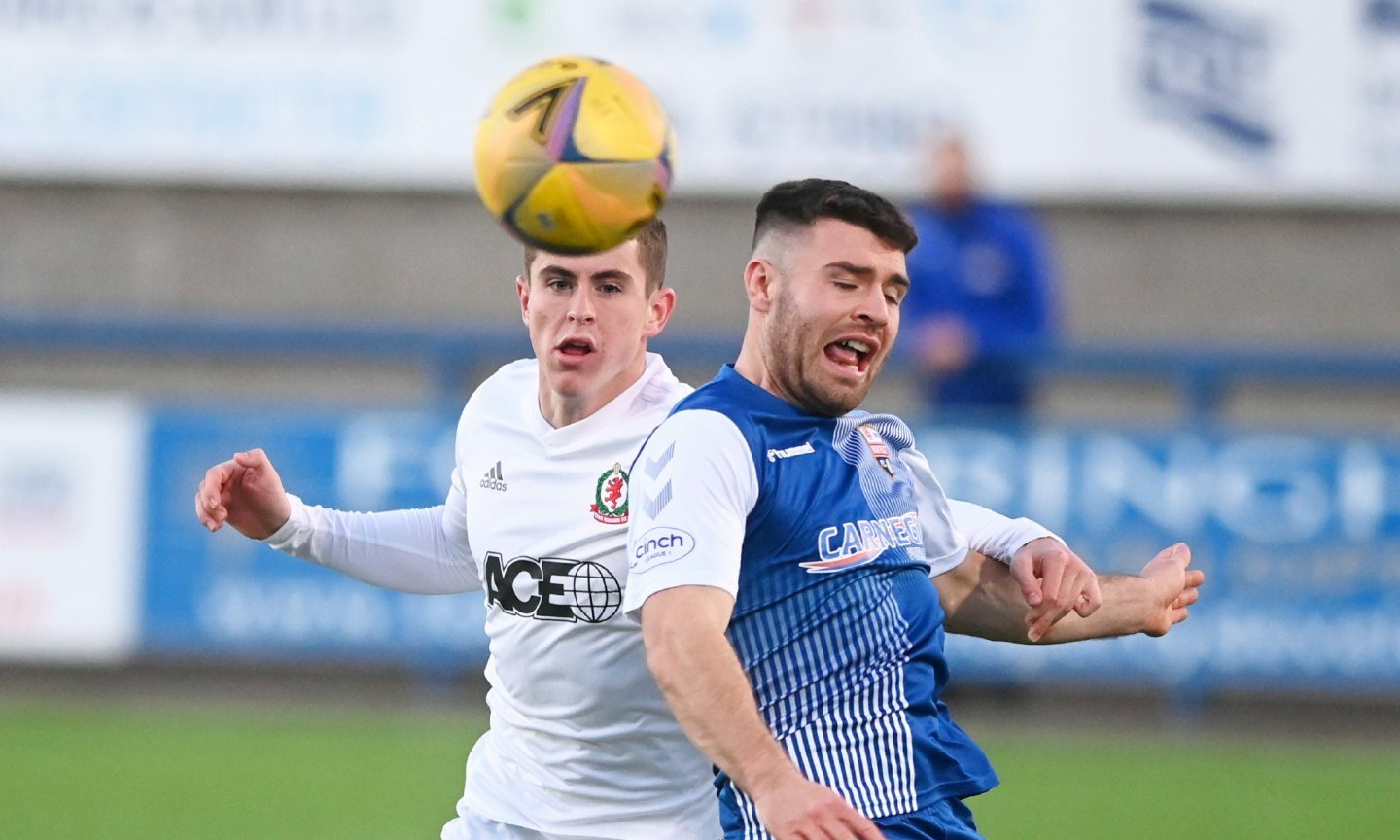 Fin Robertson (left) in action for Cove against Montrose last season.