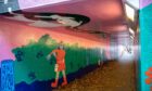 The ceiling of the mural has been damaged by vandals