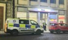 Police are carrying out investigations after a robbery at the NIsa Local on Meadowside, Dundee.
