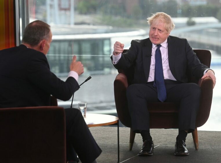 Andrew Marr interviewing Prime Minster Boris Johnson on TV.
