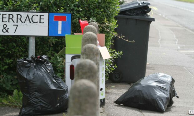 Bags of rubbish left next to grey wheelie bins will no longer be collected.