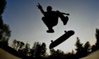 A skateboarder doing a flip trick
