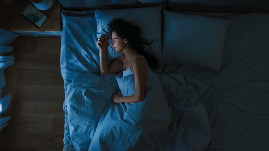 a woman sleeping in bed