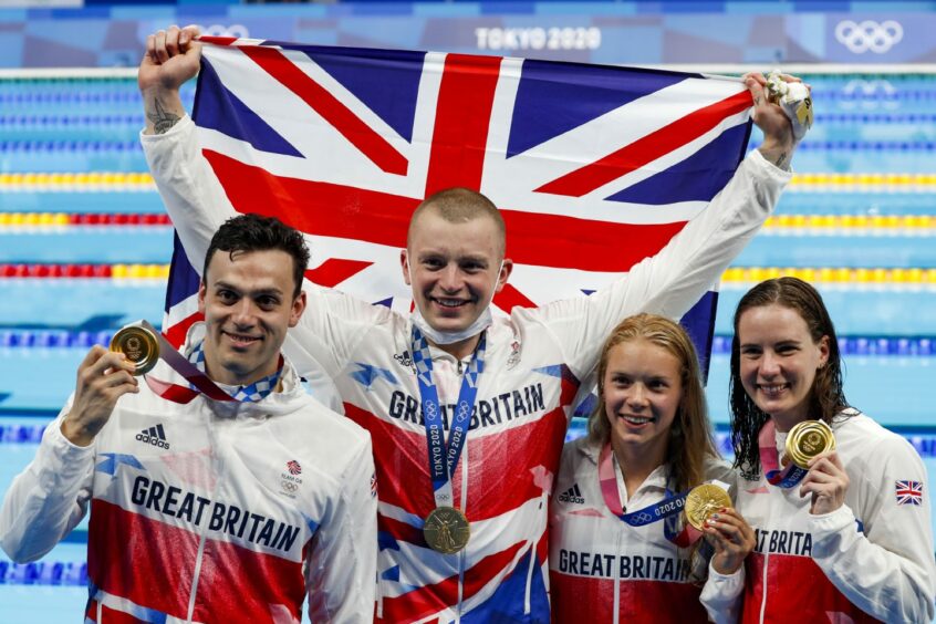 More Scottish glory at the Olympics came from Kathleen Dawson, from Kirkaldy, when her swim team claimed gold in the mixed 4x100m medley relay with an impressive time of 3;37.58 at the Tokyo Aquatics Centre, during the Tokyo Summer Olympic Games in Tokyo, Japan. Picture shows James Guy, Adam Peaty, Kathleen Dawson and Anna Hopkin celebrating with their medals. Tasos Katopodis/UPI/Shutterstock.