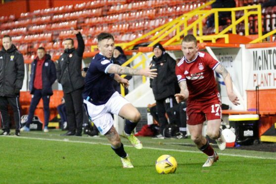 Jonny Hayes takes on Jordan McGhee.