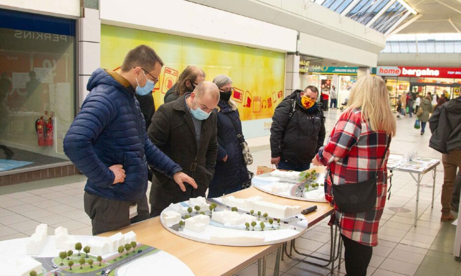 Paul Downie, second from left, discussing the plans at a public consultation event last month.