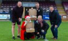 Rab Douglas, Shelley Hague, Craig McCarthy, Mike Caird and Brian Cargill with a couple of the hampers going out from Arbroath FC Community Trust. Pic: Paul Reid