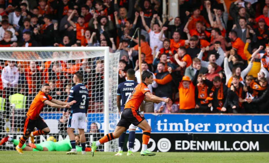 Harkes celebrates after netting the winning goal in the first Dundee derby of the season