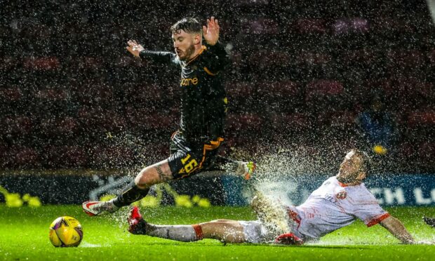 Dundee United suffered a disappointing defeat in a Motherwell monsoon