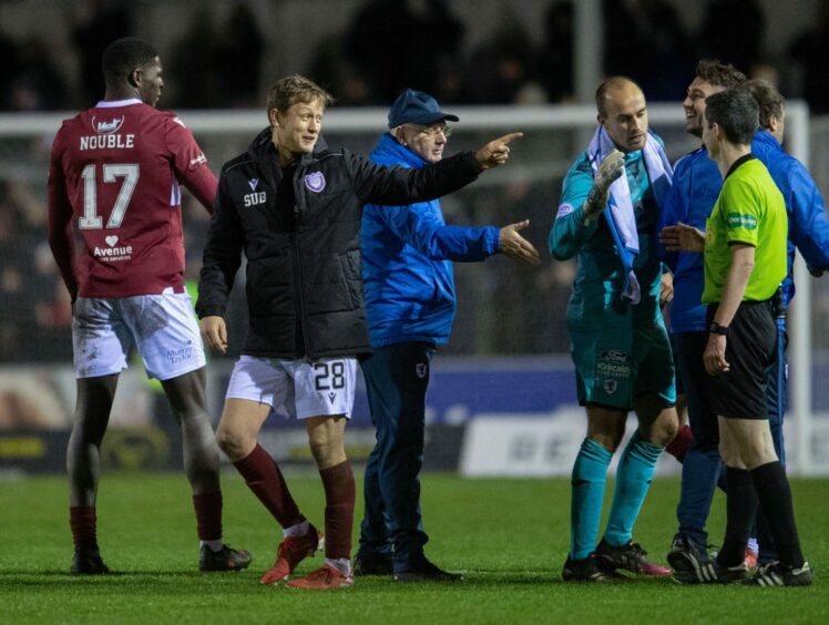 Arbroath's James Craigen has words with referee Craig Napier at full time.