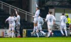 Livingston stars celebrate their winning goal at Dundee United