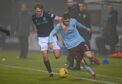 Dundee star Max Anderson challenges Hearts' Jamie Walker in last weekend's clash, which is now under investigation over betting irregularities