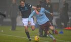 Dundee star Max Anderson challenges Hearts' Jamie Walker in last weekend's clash, which is now under investigation over betting irregularities