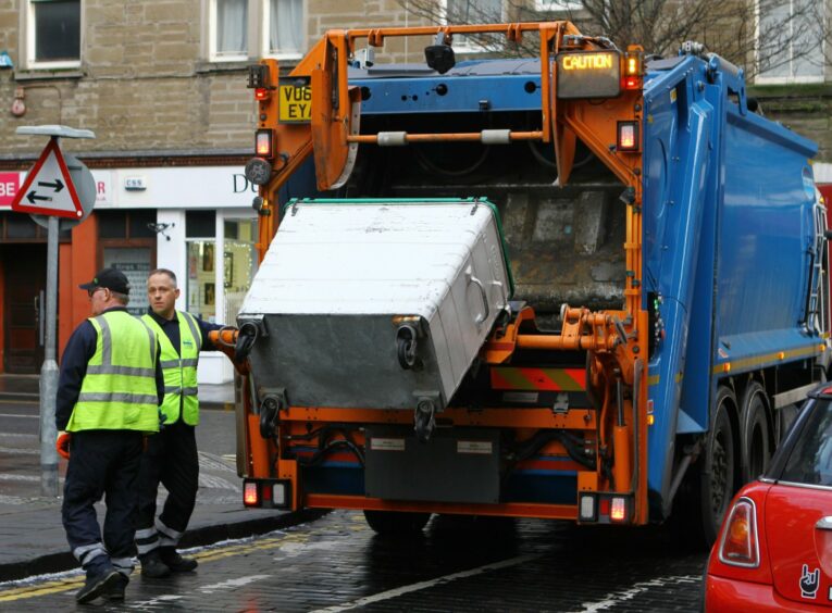 Workers collecting bins in Dundee