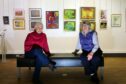 Meg Manson and Marianne Nicoll of Arbroath art society at the library exhibition. Pic: Gareth Jennings/DCT Media.