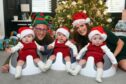 Merry Christmas from the Monifieth triplets Archie, Myles and Oliver Mudie with mum Lois and dad Craig.