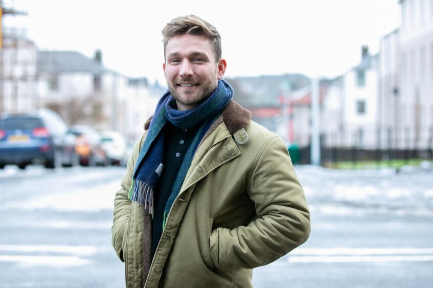 Photo shows Alistair Heather smiling on a Dundee street.
