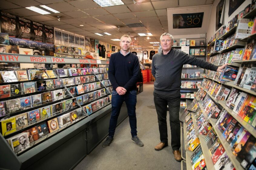 Garry Smith and his son Craig at Concorde Music in Scott Street, Perth.