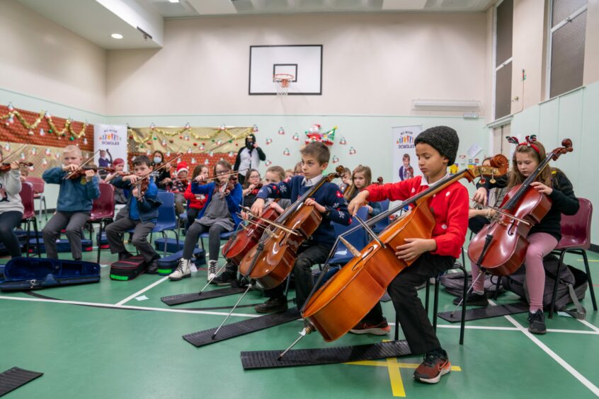 Children are given the opportunity to learn an instrument they may not have had access to. Picture: Kenny Smith / DCT Media.