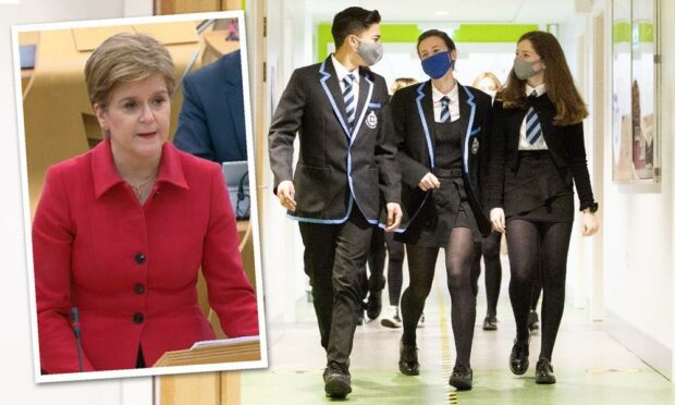 Blanket isolation of whole classes has been ruled out by the First Minister.