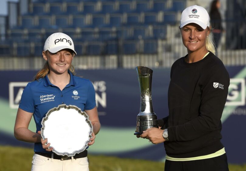 Scotland's Louise Duncan celebrates with the trophy for leading amateur and Sweden's Anna Nordqvist celebrates with the Women's British Open golf championship trophy during day four of the AIG Women's Open at Carnoustie. Ian Rutherford/PA Wire.