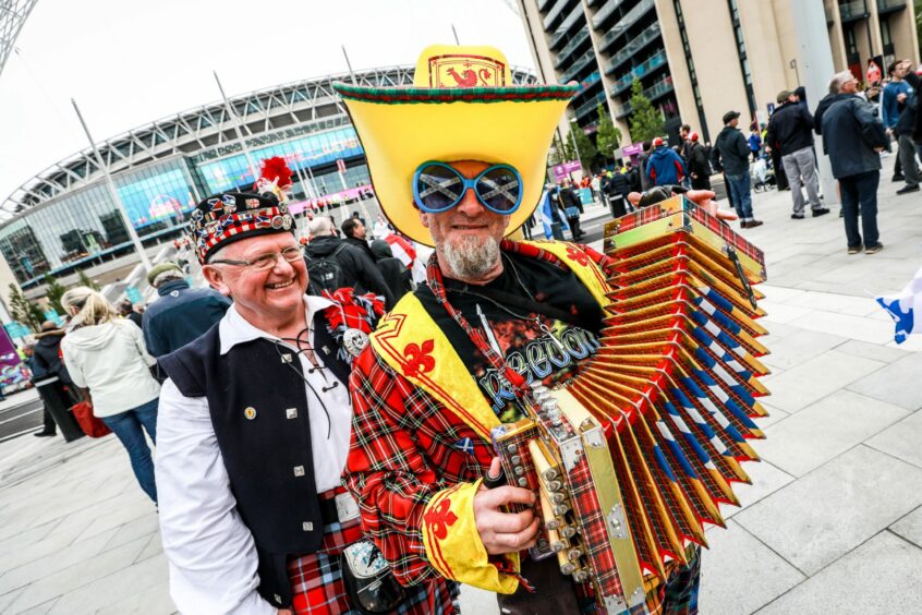 Thousands of Scottish fans descended on London for the Scotland v England match, many dressed for the occasion, including Wullie Masson from Aberdeen with Dinna BDaft (with the squeezebox).  Steve Brown / DCT Media.