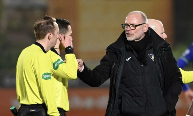Hughes speaks to the officials
