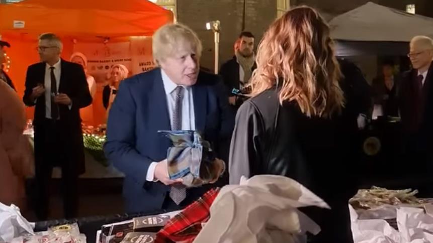 Then-Prime Minister Boris Johnston talks to Clootie McToot owner Michelle Maddox at the 10 Downing Street food and drink market earlier this year.