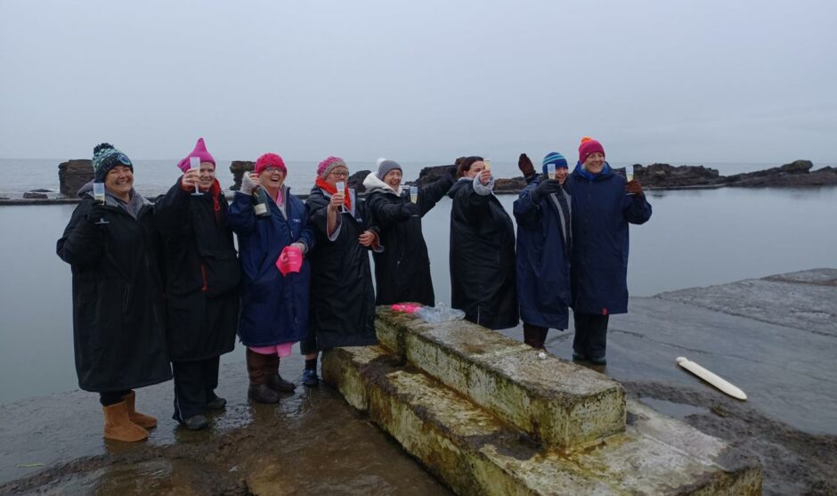 The ladies toast the end of a successful challenge after wild swimming in the East Neuk.