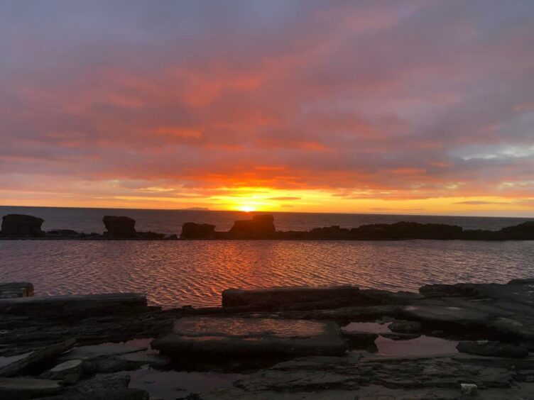 One of the sunrises over the Isle of May as seen from Cellardyke tidal pool.