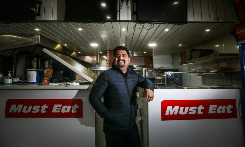 Laeeq Rehman at the counter of Must Eat. Picture: Mhairi Edwards.