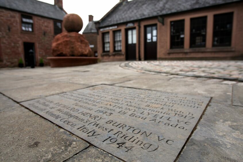 Richard Burton's name is one of three on a stone slab honouring Kirrie VCs in the town's Cumberland Close.